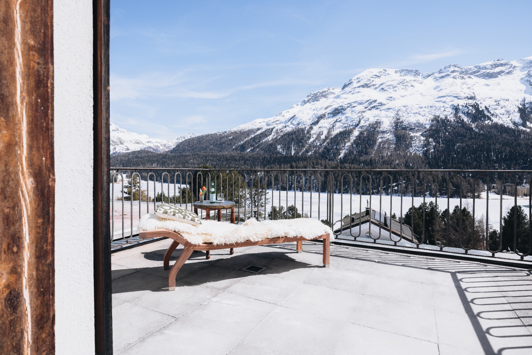 The terrace at Villa Beaulieu, looking out over Lake St. Moritz at dusk